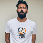 A man with a beard wearing a white crew-neck t-shirt with a colorful graphic print featuring a lotus flower, a fish, and stylized text, set against a plain beige wall.