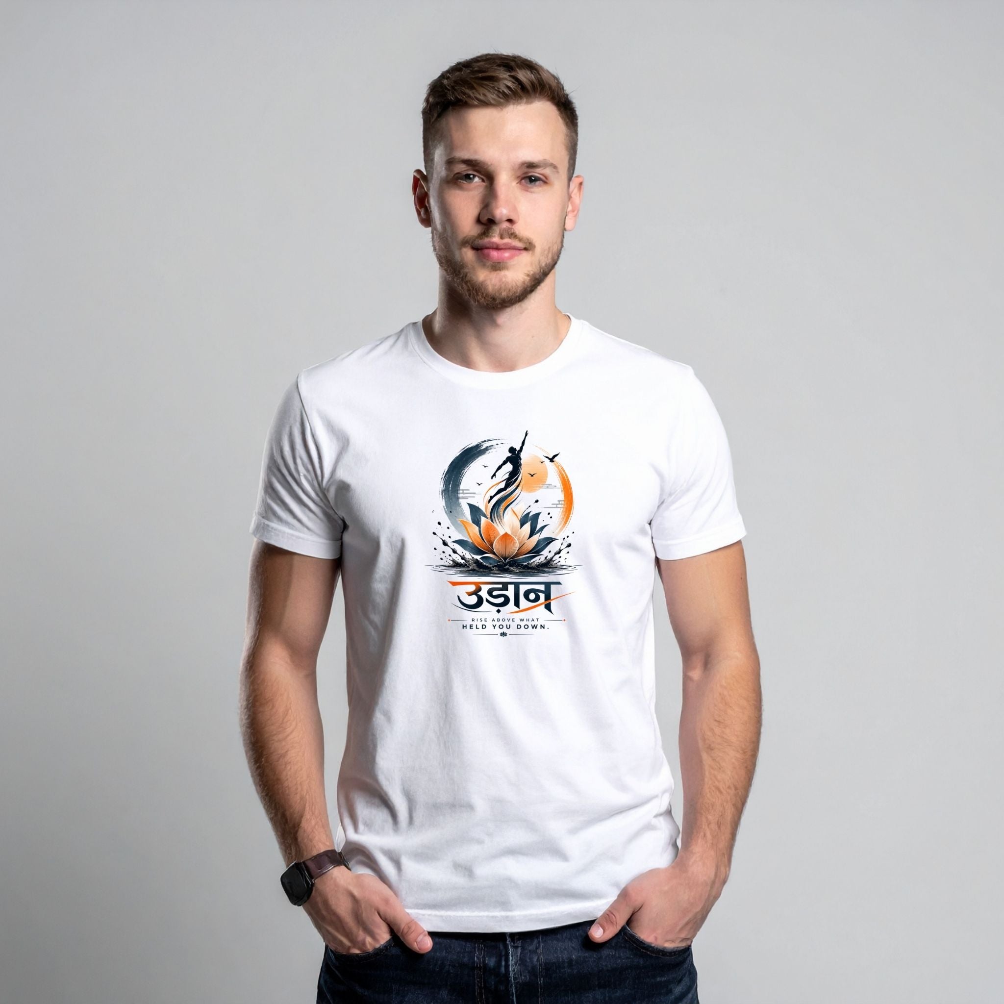 A man wearing a white crew-neck t-shirt with a colorful graphic print on the chest. The graphic features a stylized lotus flower, a silhouette of a person, and Devanagari text.